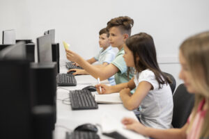 A picture of a group of students learning using computers