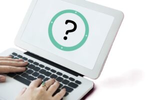 An image of a laptop with a question mark on the screen