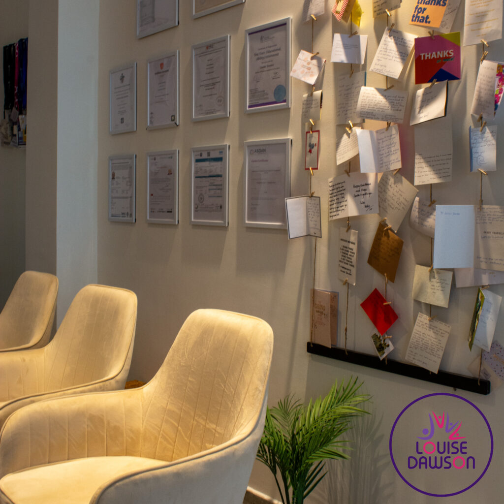 Wall display of certificates and student testimonials at the Louise Dawson centre, reflecting the high-quality, inclusive learning environment of the CambriLearn Hybrid Hub.