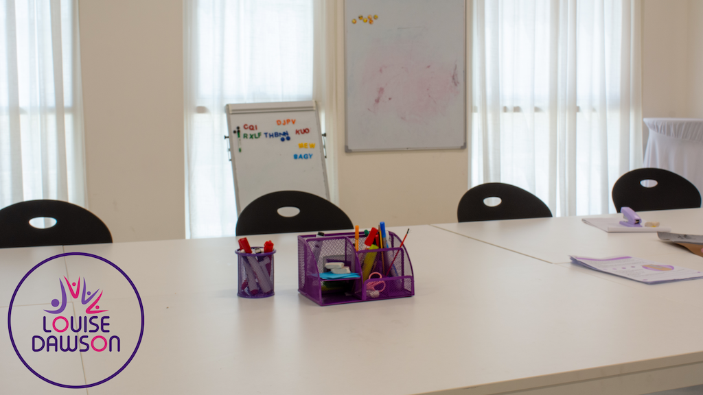 Structured classroom setting with desk space and whiteboard for CambriLearn students at the Louise Dawson Hybrid Hub in Dubai.