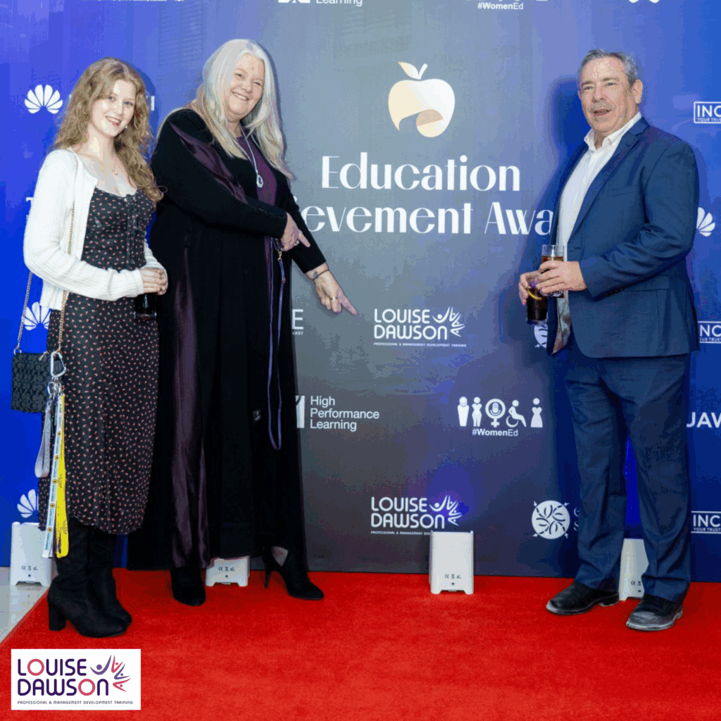 Louise Dawson, her daughter, and partner Paul Barnes posing on the red carpet at the Education Achievement Awards 2025 in Dubai, celebrating education excellence.